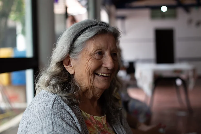 A happy, smiling older woman