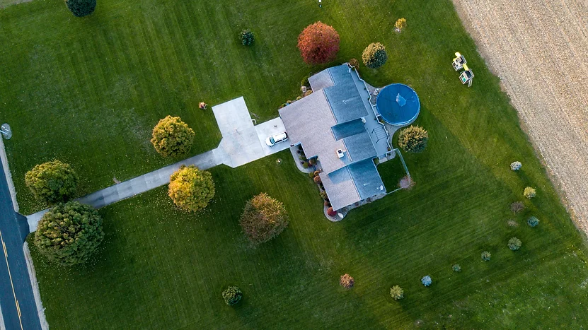 Aerial view of a home with a well-manicured lawn