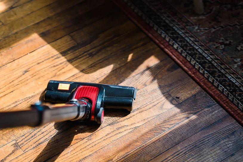 An aerial view of a vacuum on hard wood floors